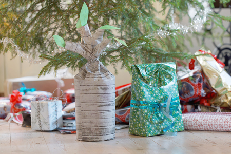Christmas presents wrapped in colorful paper below the Christmas tree
の写真素材