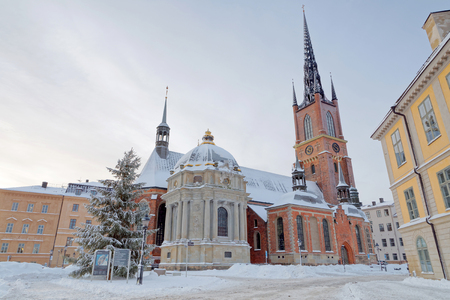 STOCKHOLM - JAN 08, 2017: The Riddarholm church in Riddarholmen in central Stockholm a cold winter morning, snow on the ground. January 08, 2017 in Stockholm, Swedenのeditorial素材