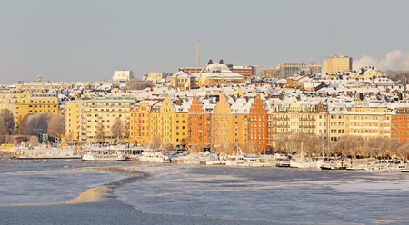 STOCKHOLM - JAN 08, 2017: Norr Malarstrand and boats in central stockholm a sunny, cold, winter morning, ice on the sea. January 08, 2017 in Stockholm, Swedenのeditorial素材