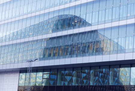 The conference building Aula Medica reflecting in a glass fasadeの写真素材