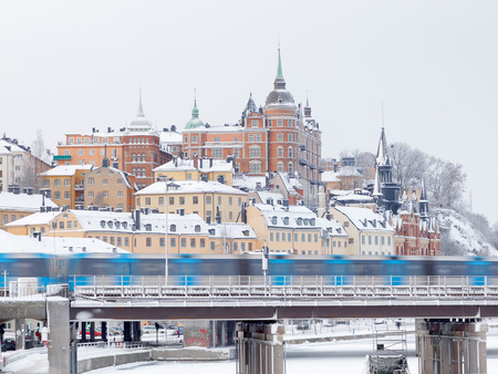 STOCKHOLM - JAN 08, 2017: Subway and fantastic architecture with brick wall in central stockholm a sunny winter day, ice on the sea. January 08, 2017 in Stockholm, Swedenのeditorial素材