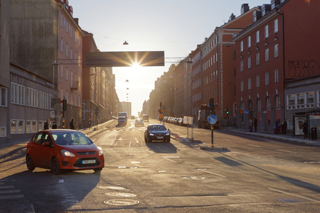 STOCKHOLM - JAN 15, 2017: Traffic, street, cars and people at sunrise. January 15, 2017 in Vasastaden, Stockholm, Swedenのeditorial素材