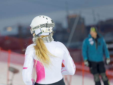 STOCKHOLM, SWEDEN - JAN 31, 2017: Rear view of Mikaela Shiffrin inspecting the ski slope used for parallel slalom, at the Alpine Audi FIS Ski World Cup. January 31, 2017, Stockholm, Swedenのeditorial素材