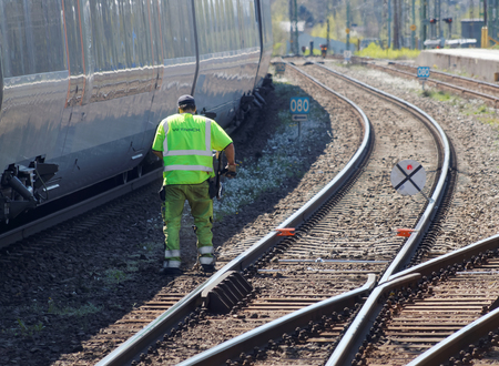 HASSLEHOLM, SWEDEN - MAY 05, 2016: Tracklayer working with the railroad at the train station. May 05, 2016, Hassleholm, Swedenのeditorial素材