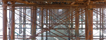 Brighton pier at sunset seen from below, warm brown colorsのeditorial素材