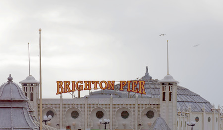 Closeup of the entrance of the Brighton pier, LED illumination of the letters BRIGHTON PIERのeditorial素材