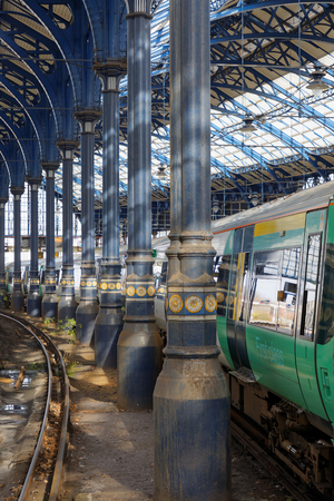 BRIGHTON, GREAT BRITAIN - FEB 24, 2017: Two trains in the beautiful old train station in Brighton, UK. February 24, 2017 in Brighton, Great Britainのeditorial素材