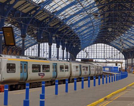 BRIGHTON, GREAT BRITAIN - MAR 01, 2017: Two trains in the beautiful old train station in Brighton, UK. March 01, 2017 in Brighton, Great Britainのeditorial素材