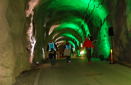 STOCKHOLM, SWEDEN - MAR 25, 2017: Rear view of seniors walking in a steep ascent  in the Stockholm Tunnel Run Citybanan 2017. March 25, 2017 in Stockholm, Swedenのeditorial素材