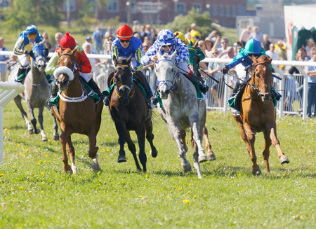 STOCKHOLM, SWEDEN - JUNE 06, 2017: Jockeys on gallop arabian race horses storming ahead at Nationaldags Galoppen at Gardet. June 6, 2017 in Stockholm, Swedenのeditorial素材