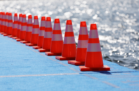 STOCKHOLM - AUG 26, 2017: Red cones on at the start of the triathlon swimming bridge in the Women's ITU World Triathlon series event August 22, 2017 in Stockholm, Swedenのeditorial素材