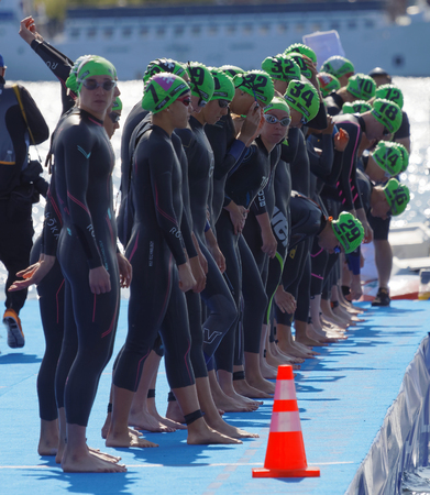 STOCKHOLM - AUG 26, 2017: The female swimming competitors waiting for the start signal in the Women's ITU World Triathlon series event August 22, 2017 in Stockholm, Swedenのeditorial素材