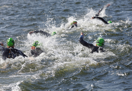 STOCKHOLM - AUG 26, 2017: Chaos of swimming female competitors fighting, water squirting in the Women's ITU World Triathlon series event August 22, 2017 in Stockholm, Swedenのeditorial素材