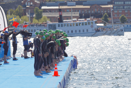 STOCKHOLM - AUG 26, 2017: The female swimming competitors waiting for the start signal in the Women's ITU World Triathlon series event August 22, 2017 in Stockholm, Swedenのeditorial素材