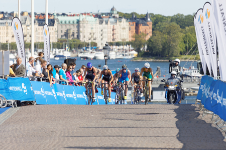 STOCKHOLM - AUG 26, 2017: Climbing group of female triathlete cyclists Gentle, Hewitt, Lee and Miller in the Women's ITU World Triathlon series event August 26, 2017 in Stockholm, Swedenのeditorial素材