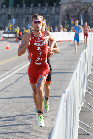 STOCKHOLM - AUG 26, 2017: Group of running triathletes, Sylvain Fridelance (SUI) and competitors in the Men's ITU World Triathlon series event August 26, 2017 in Stockholm, Swedenのeditorial素材