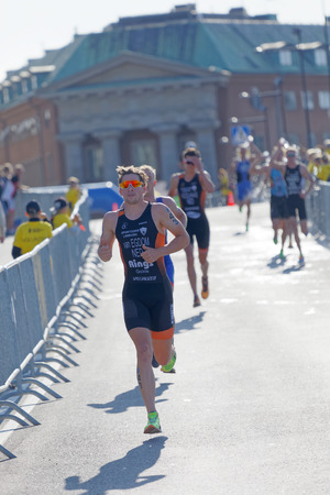 STOCKHOLM - AUG 26, 2017: Group of running triathletes, Van Egdon (NED) and competitors in the Men's ITU World Triathlon series event August 26, 2017 in Stockholm, Swedenのeditorial素材