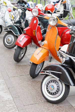 STOCKHOLM, SWEDEN - SEPT 02, 2017: Parked colorful red, orange and black old fashioned vespa scooters  at the Mods vs Rockers event at the Saint Eriks bridge, Stockholm, Sweden, September 02, 2017のeditorial素材