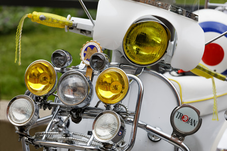STOCKHOLM, SWEDEN - SEPT 02, 2017: Lots of lamps on a white modified old fashioned classic vespa scooter  at the Mods vs Rockers event at the Saint Eriks bridge, Stockholm, Sweden, September 02, 2017のeditorial素材