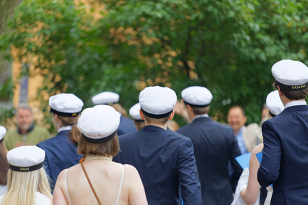 STOCKHOLM, SWEDEN - JUN 13, 2017: Rear view of swedish students wearing graduation caps dresses and suits after graduation at the school Norra Real, June 13 2017,Stockholm,Swedenのeditorial素材