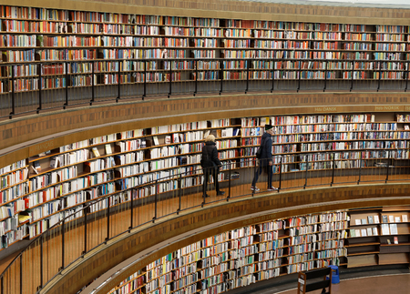 STOCKHOLM, OCT 30 2017: People in the city library in Stockholm called Stadsbiblioteket, in beautiful central rotunda. October 30, 2017, Stockholm, Sweden.のeditorial素材