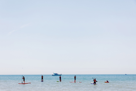 BRIGHTON, GREAT BRITAIN - JUN 17, 2017: People practice Stand Up Paddleboarding outside the Brighton beach. June 17, 2017 in Brighton, Great Britainのeditorial素材