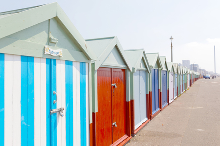 BRIGHTON, GREAT BRITAIN - JUN 19, 2017: Lots of very colorful bathing huts in Brighton and Hove. No people and blue sky. June 19, 2017 in Brighton, Great Britainのeditorial素材