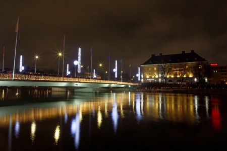 Light festival and the at the river Motala Strom and buildings reflecting in the water during the evening in central Norrkoping in Swedenのeditorial素材