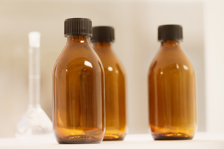 Closeup of brown bottles used in the labの写真素材