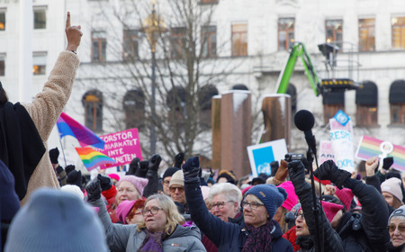 STOCKHOLM, SWEDEN - JAN 21, 2018: Women raising their hands in the Womens March, a worldwide protest for women's rights in central Stockholm, Norrmalmstorg, Sweden, January 21, 2018のeditorial素材