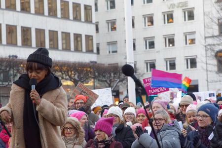 STOCKHOLM, SWEDEN - JAN 21, 2018: Women clap their hands in the Womens March, a worldwide protest for women's rights in central Stockholm, Norrmalmstorg, Sweden, January 21, 2018のeditorial素材