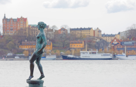 STOCKHOLM, SWEDEN - APR 29, 2017: Statue called The Dance made by Carl Eldh in copper outside the Stockholm City Hall. April 29, 2017 in Stockholm, Swedenのeditorial素材