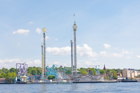 STOCKHOLM, SWEDEN - JUN 06, 2017: Amusement park Grona lund with rollor coster free falling tower in Stockholm, Sweden, June 06, 2017.のeditorial素材