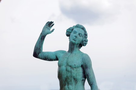STOCKHOLM, SWEDEN - APR 29, 2017: Statue called The Song made by Carl Eldh in copper outside the Stockholm City Hall. April 29, 2017 in Stockholm, Swedenのeditorial素材