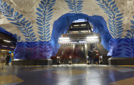 STOCKHOLM, SWEDEN - FEB 27, 2018: Motion blurred people walking in the underground subway station T-Centralen, escalator in the background in Stockholm, Sweden, February 27, 2018のeditorial素材