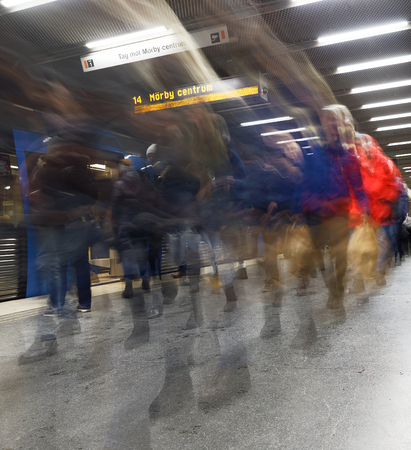 STOCKHOLM, SWEDEN - FEB 27, 2018: Stressed motion blurred people walking on the platform in the underground subway station Tekniska Hogskolan in Stockholm, Sweden, February 27, 2018のeditorial素材
