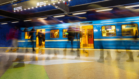 STOCKHOLM, SWEDEN - FEB 27, 2018: Stressed motion blurred people walking on and off the blue train in the underground subway station T-Centralen in Stockholm, Sweden, February 27, 2018のeditorial素材
