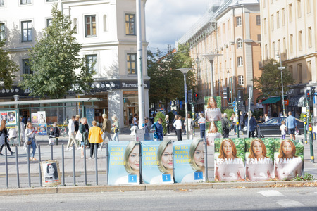 STOCKHOLM, SWEDEN - AUG 26, 2018: Political partys posters trying to get votes during the election campaign. Sweden, August 26, 2018 in central Stockholm, Swedenのeditorial素材