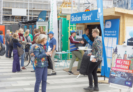 STOCKHOLM, SWEDEN - AUG 26, 2018: Political partys at their polling huts trying to get votes during the election campaign, August 26, 2018 in central Stockholm, Swedenのeditorial素材