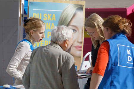 STOCKHOLM, SWEDEN - AUG 26, 2018: Political partys at their polling huts trying to get votes during the election campaign, August 26, 2018 in central Stockholm, Swedenのeditorial素材