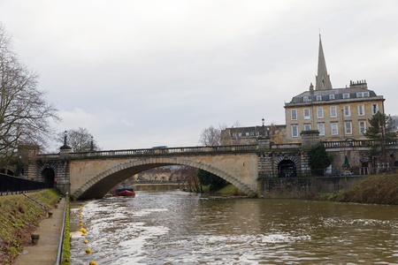 BATH, GREAT BRITAIN - DEC 26, 2018: The river Avon in Bath UK and a bridge and buildings. December 26, 2018 in Bath, Great Britainのeditorial素材