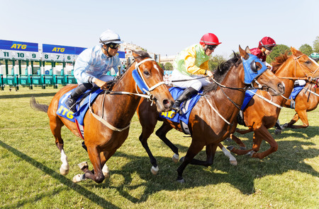 STOCKHOLM, SWEDEN - JUNE 06, 2019: Start of the gallop race for arabian race horses and colorful jockeys at ATG Nationaldags Galoppen at Gardet. June 6, 2019 in Stockholm, Swedenのeditorial素材