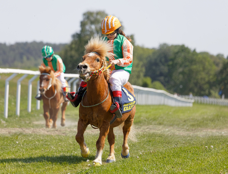 STOCKHOLM, SWEDEN - JUNE 06, 2019: Many young jockey girls riding cute ponys at Nationaldags Galoppen at Gardet. June 6, 2019 in Stockholm, Swedenのeditorial素材
