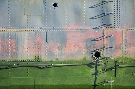 Old abandoned boat. View of part of an old damaged chip With Different effects of aging.