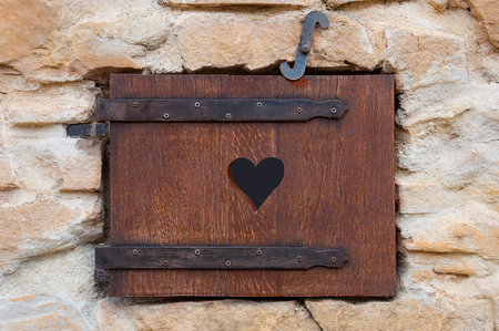 Wooden window on stone wall romanticの写真素材