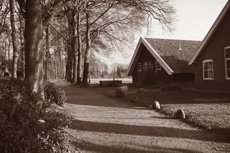 farmhouse in sepia tones somewhere in hollandの写真素材