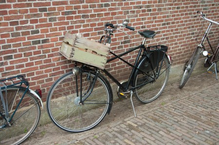 carrier bike parked against wallの写真素材