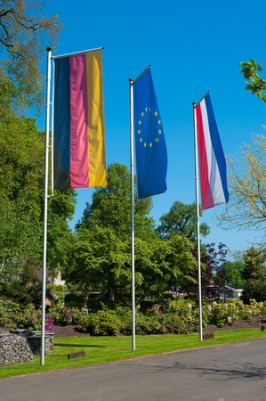 german and dutch flag with in the middle the blue european union flag の写真素材