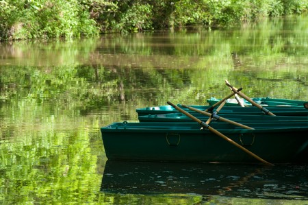 Row boats on the Alstatter Aa, on the border between germany and Netherlands. They can be hired by tourists.の写真素材