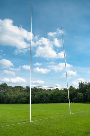 rugby post against cloudy blue skyの写真素材